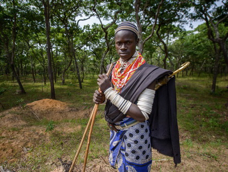A tourist participating in the Maasai traditional jumping dance
